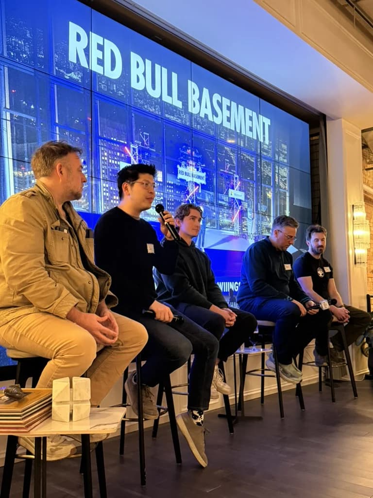 Jerry Jiang speaking into a microphone on a local founder panel.